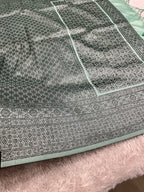 STF50 – Elegant Sea Green Dupion Saree with Embossed Woven Designs