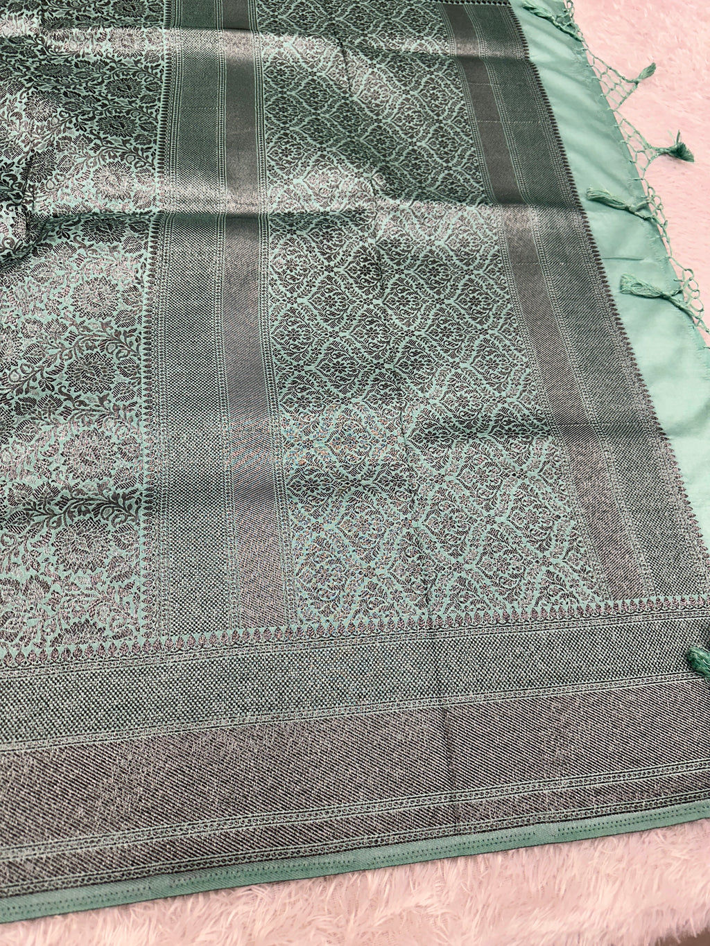 STF49 – Enchanting Sea Green Dupion Saree with Embossed Floral Woven Designs