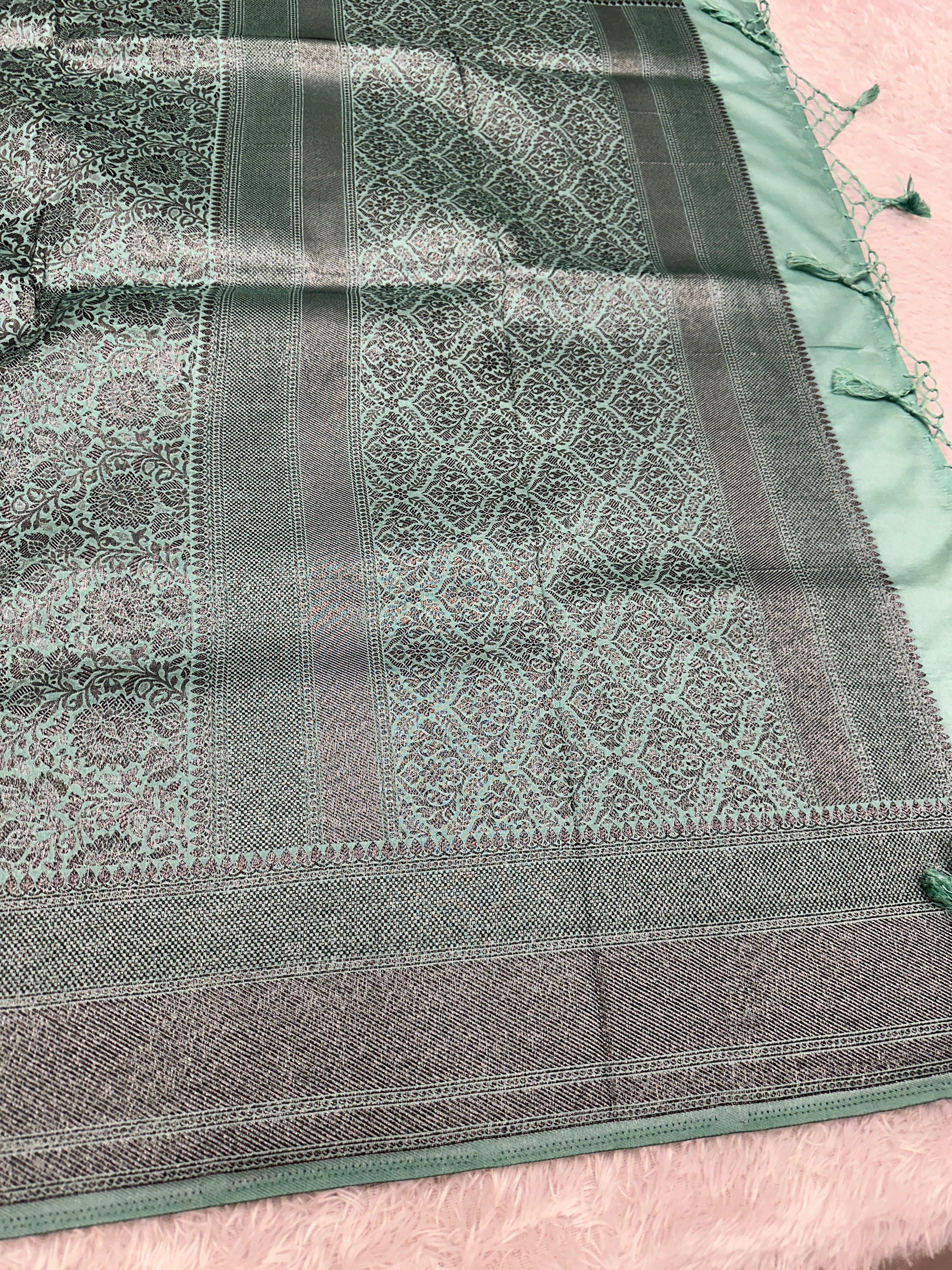 STF49 – Enchanting Sea Green Dupion Saree with Embossed Floral Woven Designs