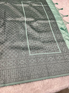 STF50 – Elegant Sea Green Dupion Saree with Embossed Woven Designs