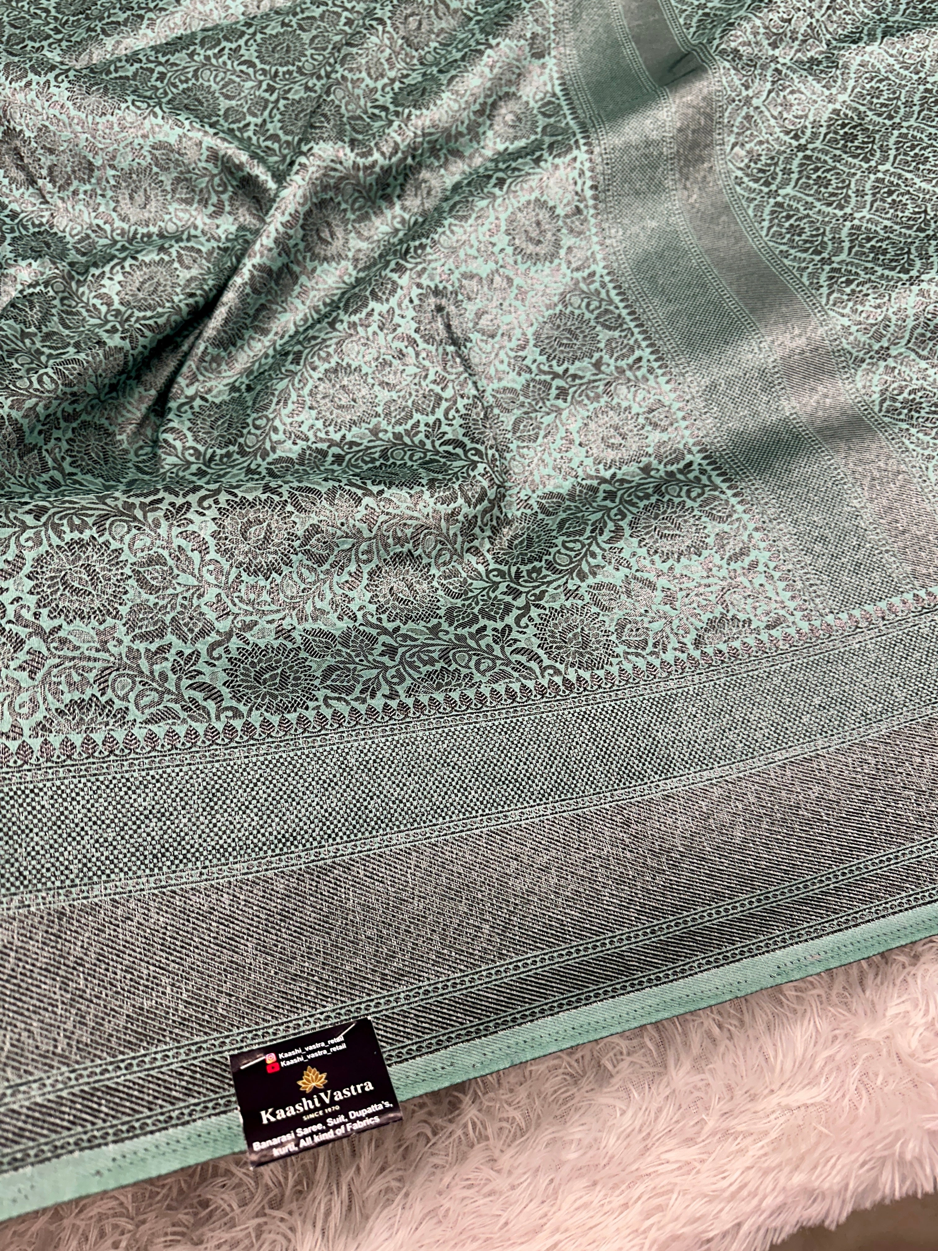 STF49 – Enchanting Sea Green Dupion Saree with Embossed Floral Woven Designs