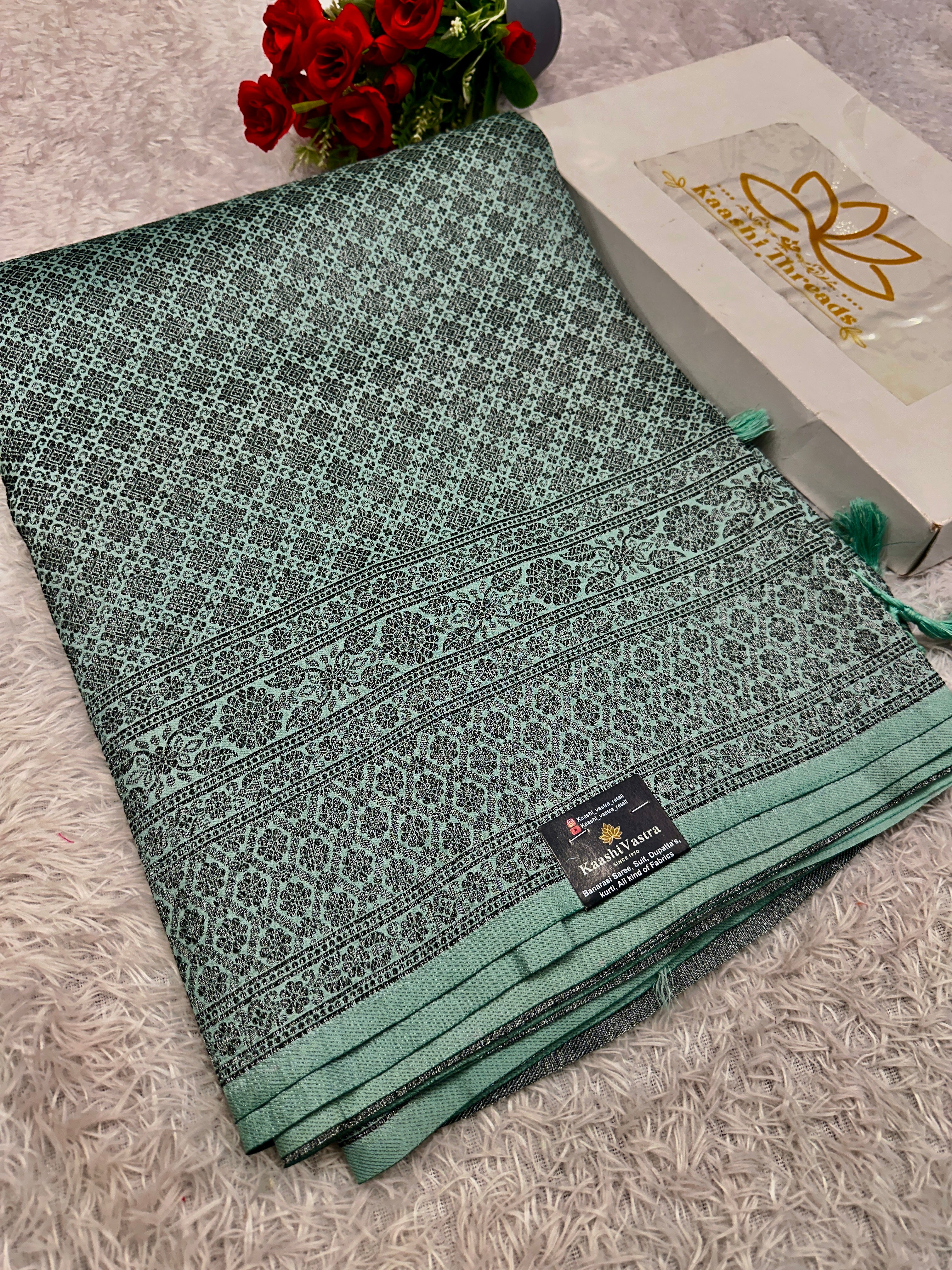 STF50 – Elegant Sea Green Dupion Saree with Embossed Woven Designs
