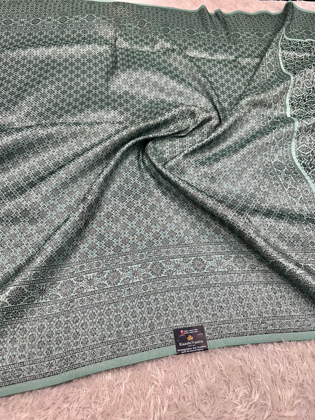STF50 – Elegant Sea Green Dupion Saree with Embossed Woven Designs
