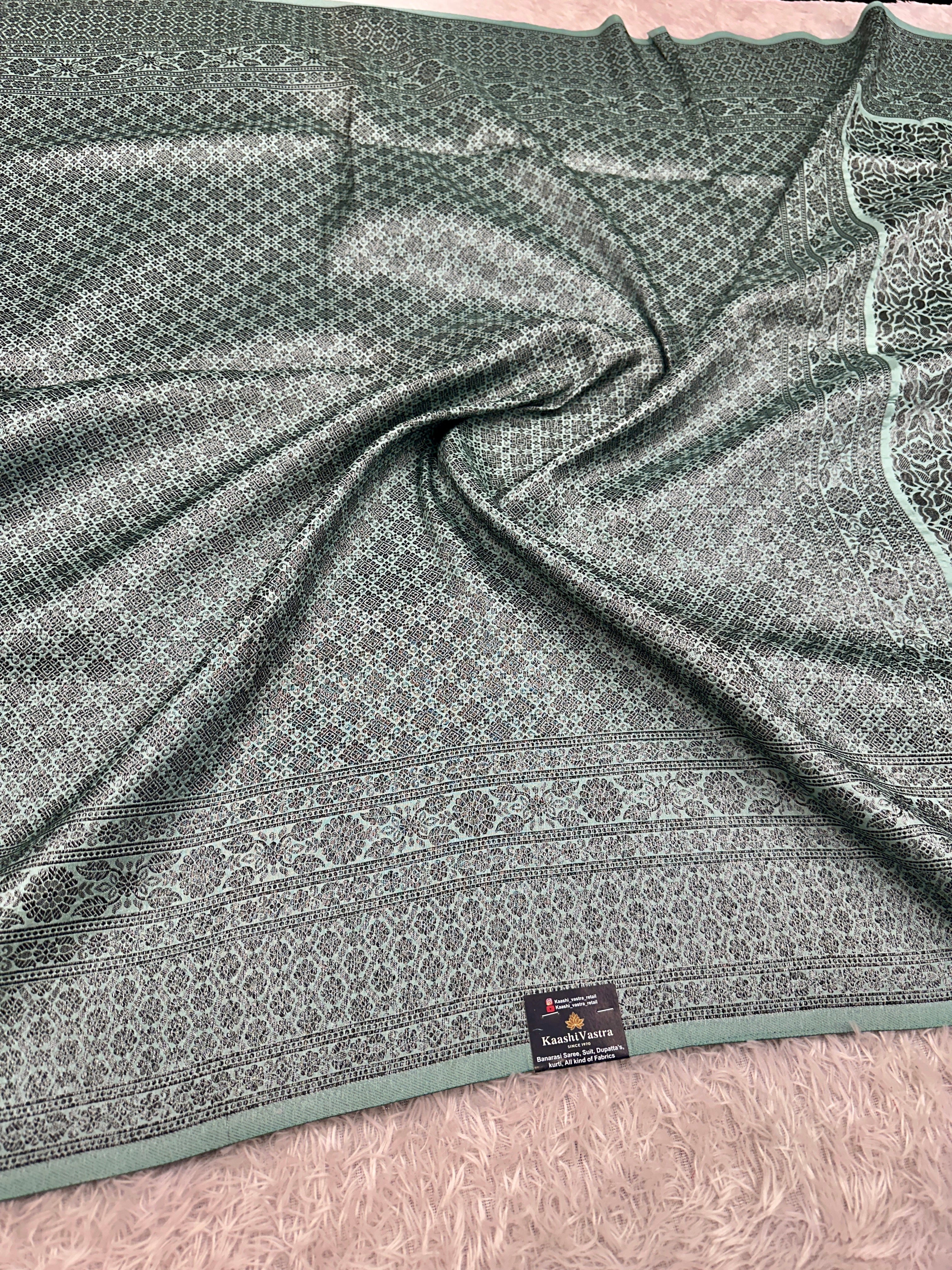 STF50 – Elegant Sea Green Dupion Saree with Embossed Woven Designs